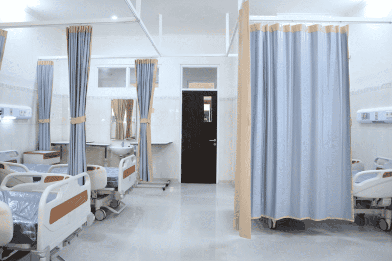 Emergency room with hospital beds cleaned by commercial disinfectant services