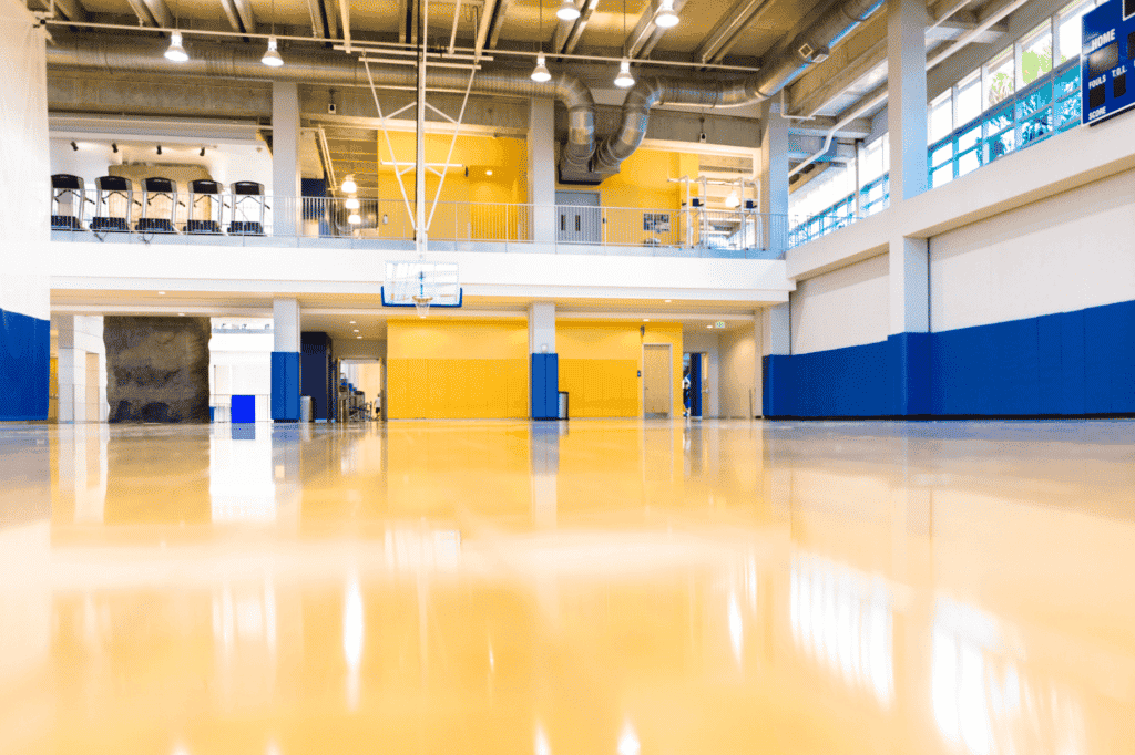 An indoor basketball court, well-maintained and clean, thanks to business cleaning services